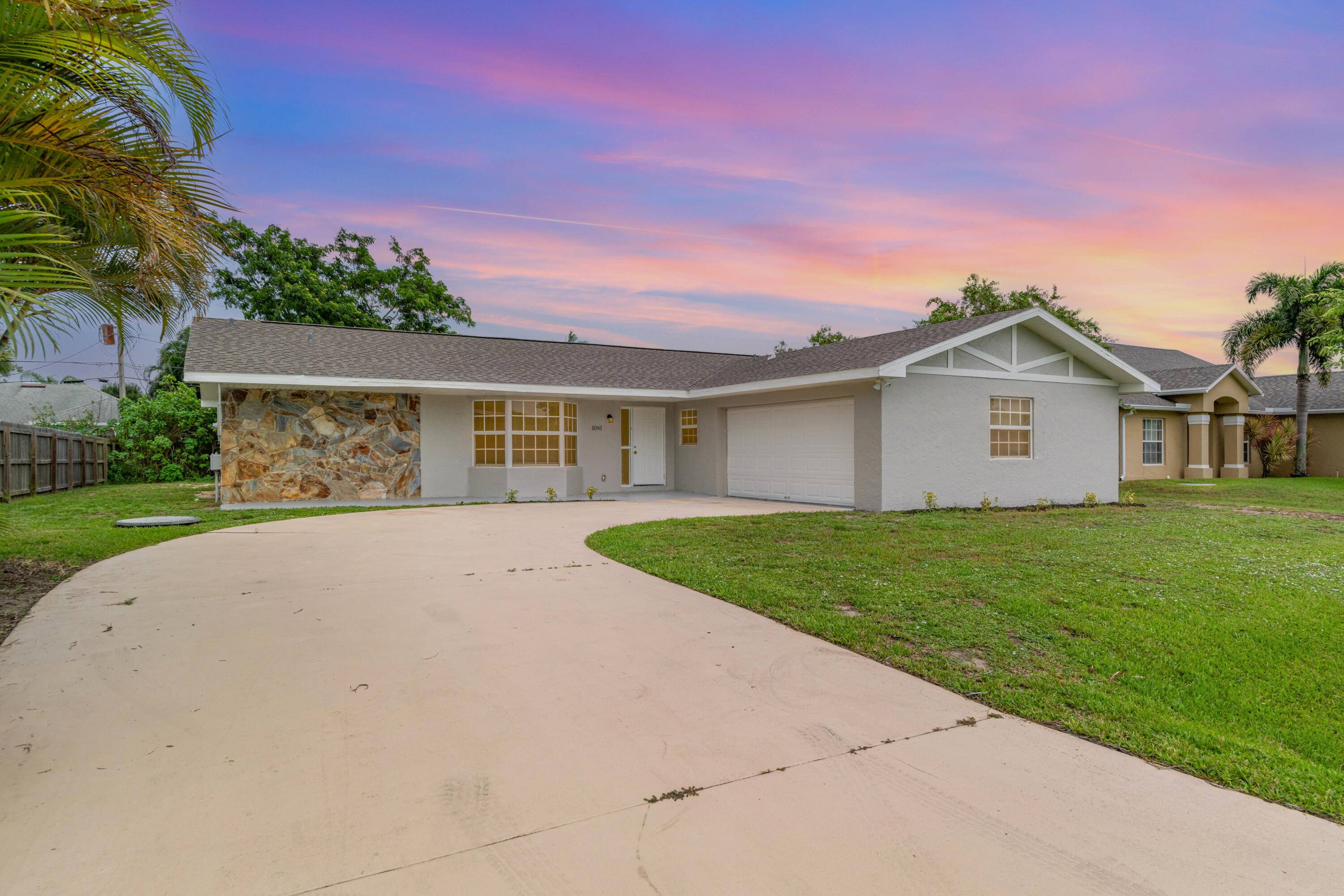 Welcome to this inviting 3 bedroom, 2 bath home in Port Saint Lucie's sought after Palm Trails neighborhood.