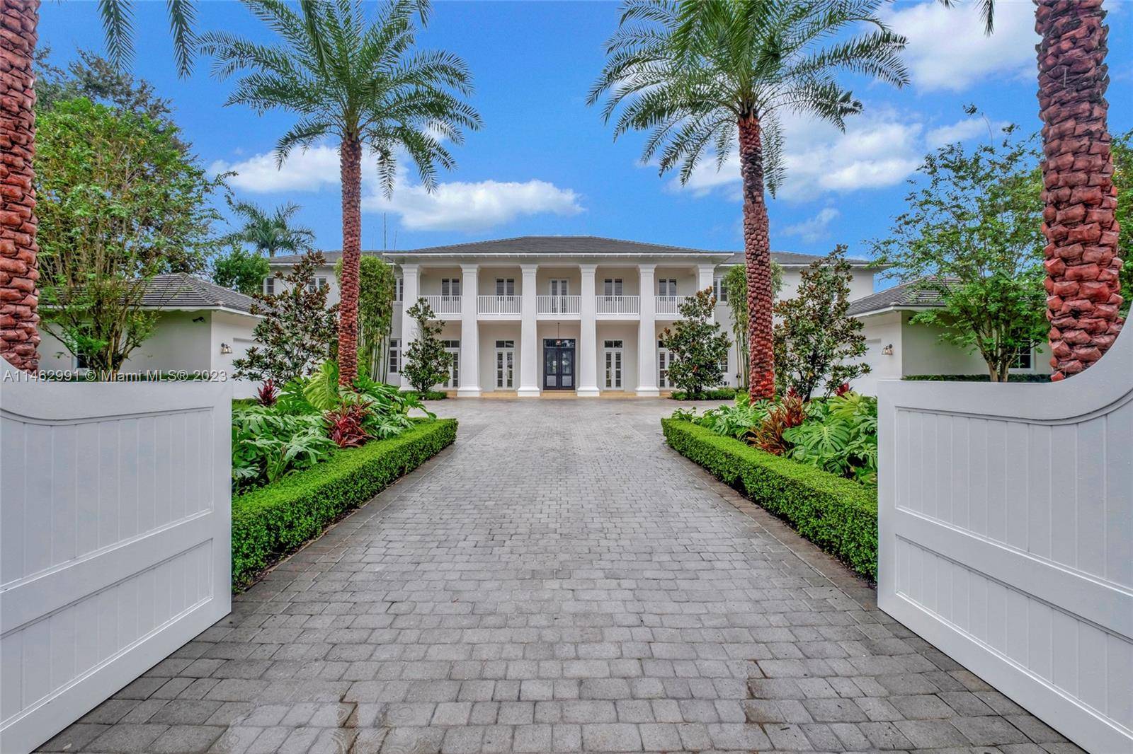 Elegant Colonial style estate was designed by renowned architect Cesar Molina.
