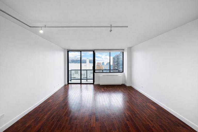 Bright high floor apartment with open city views in a full service Midtown East condominium.