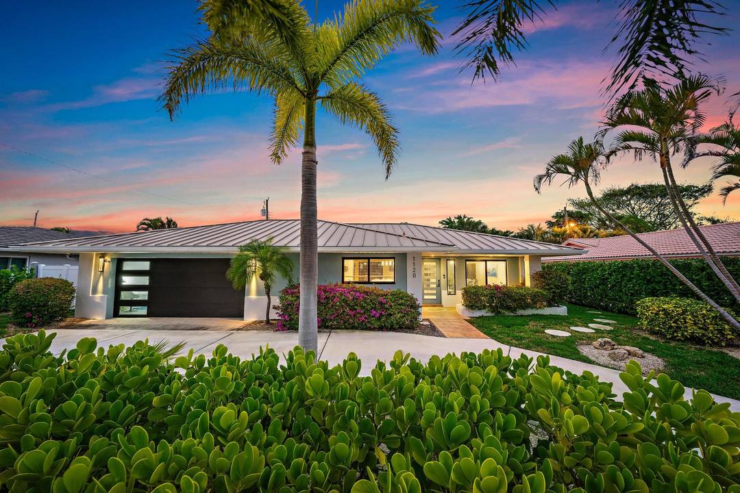 Experience refined coastal living in this beautifully renovated, move in ready residence just a short stroll from the pristine sands of Singer Island.