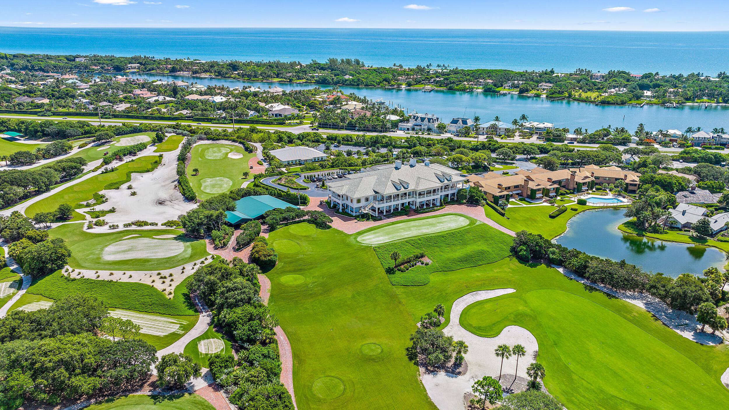 Convenience and ease of living in this 2 bedroom, 2 full and one 1 2 bath golf residence with pool at prestigious Jupiter Hills.