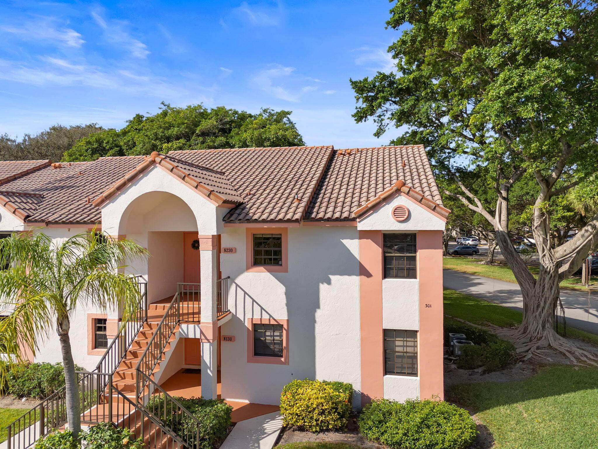 Updated, just FRESHLY PAINTED WHITE, 2 bed 2 bath corner condo more windows with corner unit on the second floor with screened in patio, in Boca Raton's BEST KEPT SECRET ...