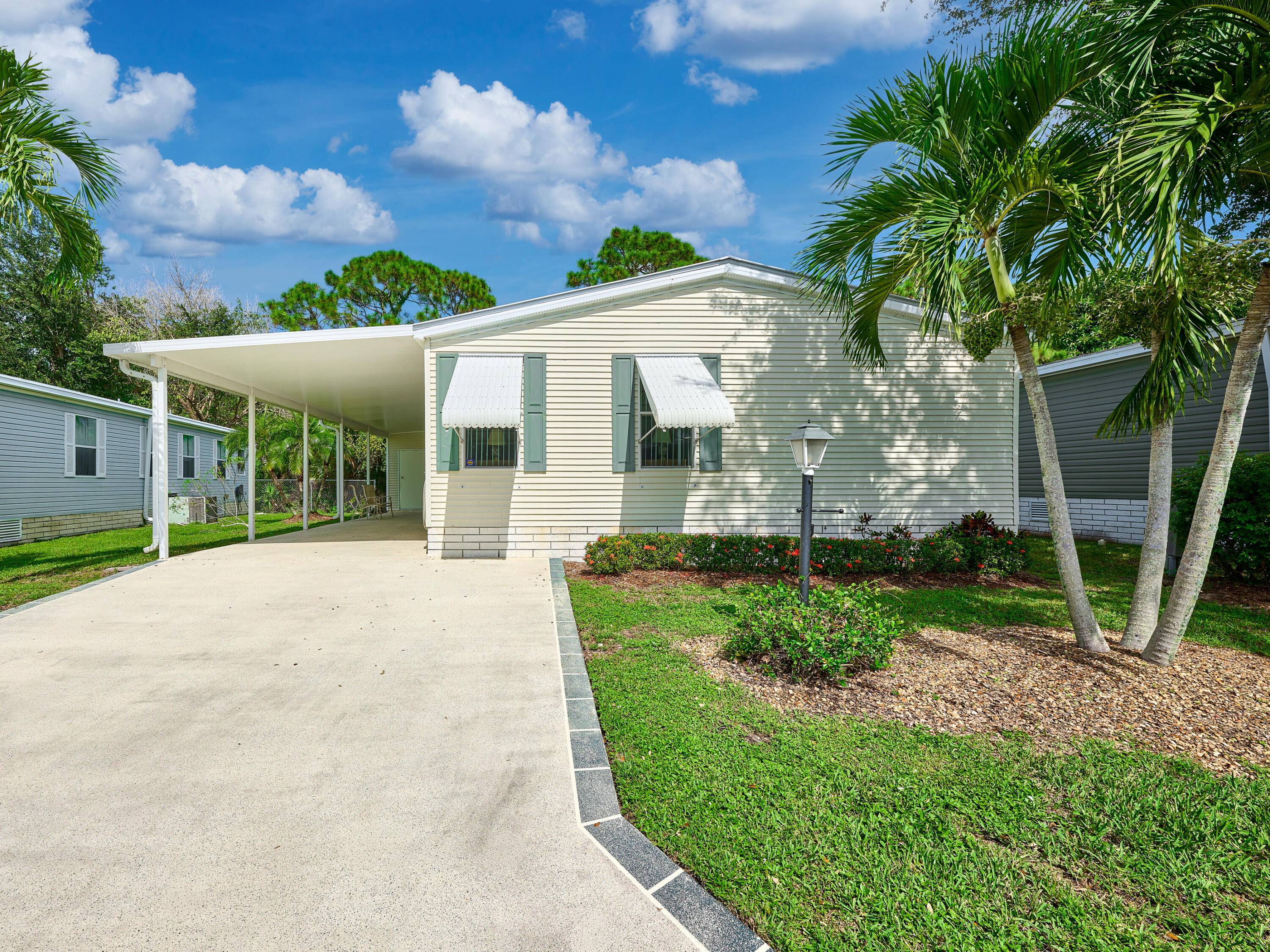 Welcome to this beautifully maintained 3 bedroom 2 bath Palm Harbor manufactured home in the sought after 55 community of Pinelake Gardens Estates.