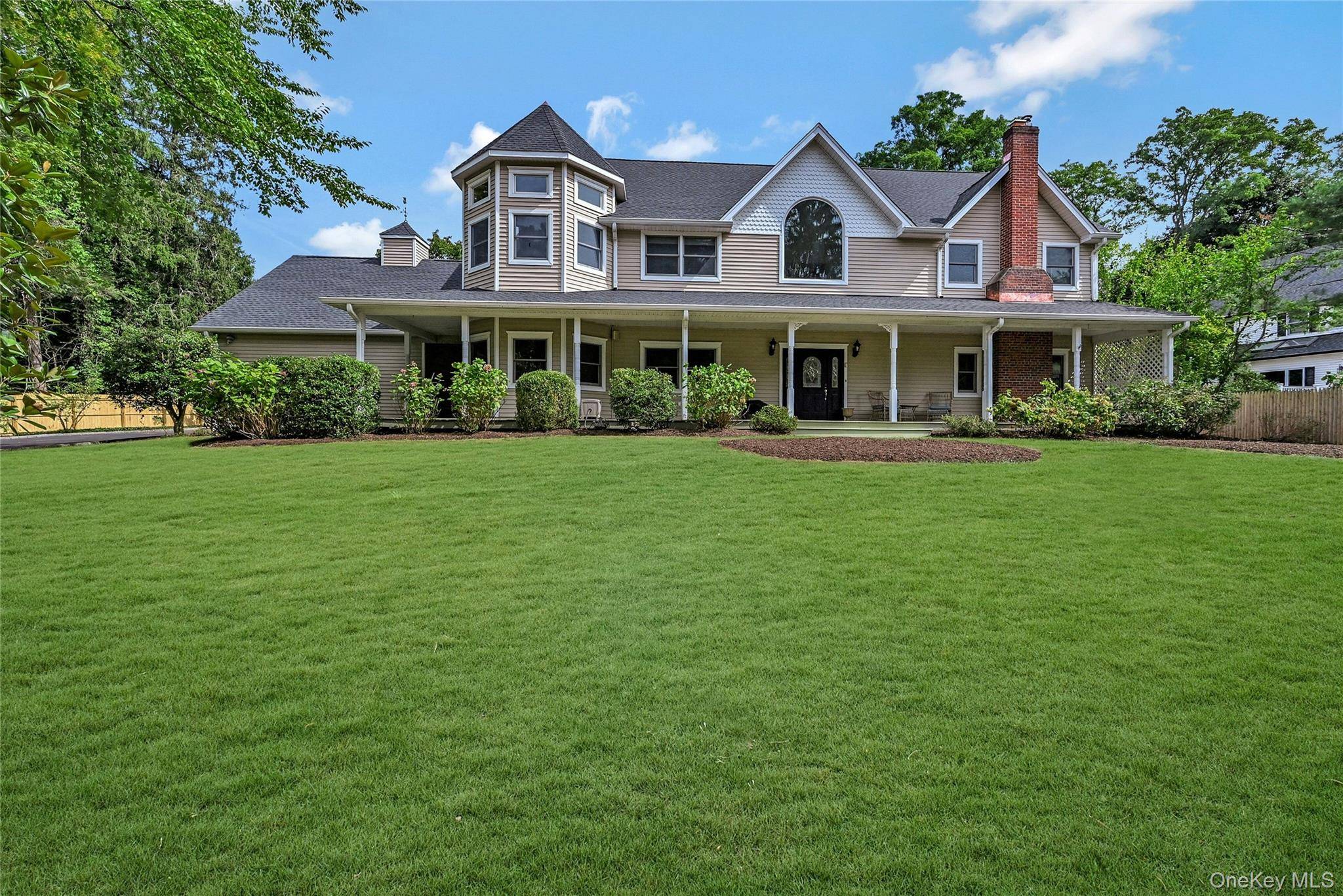 An expansive front porch welcomes you to this stunning 4, 400 sq.