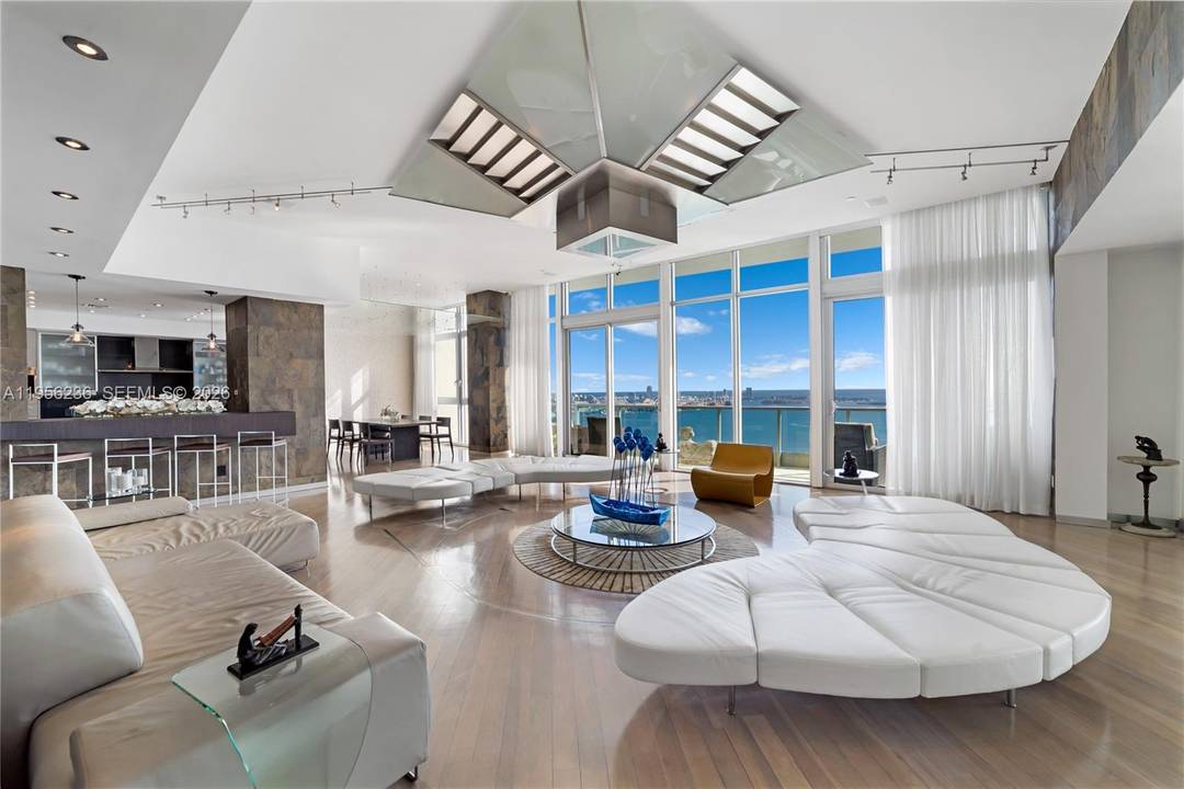 Unobstructed Miami skyline vistas await in this stunning, sprawling residence, where dramatic floor to ceiling windows frame breathtaking views from nearly every space.