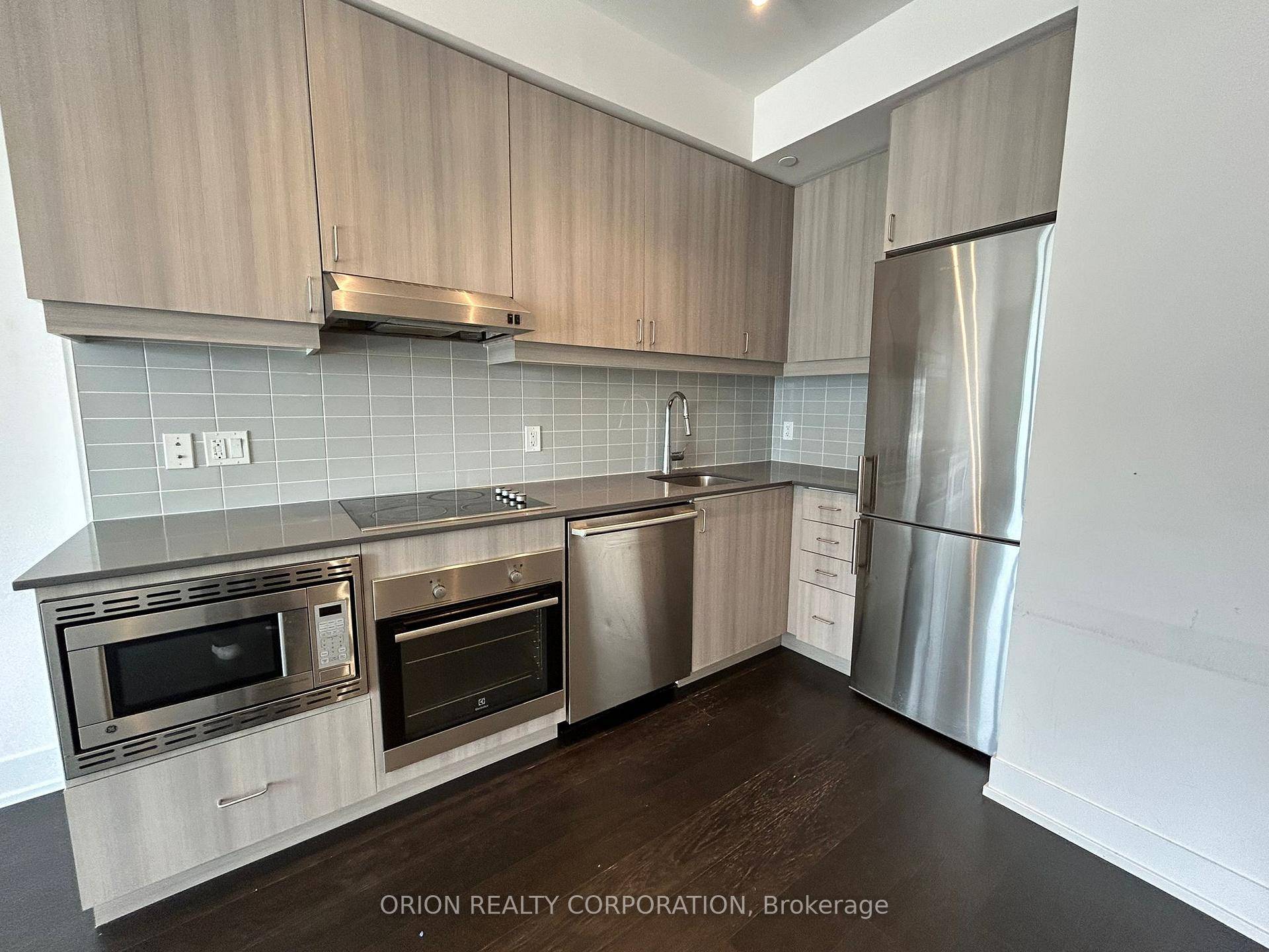 Discover the spacious living area of this 1 bedroom plus den unit at Lotus Condominiums.