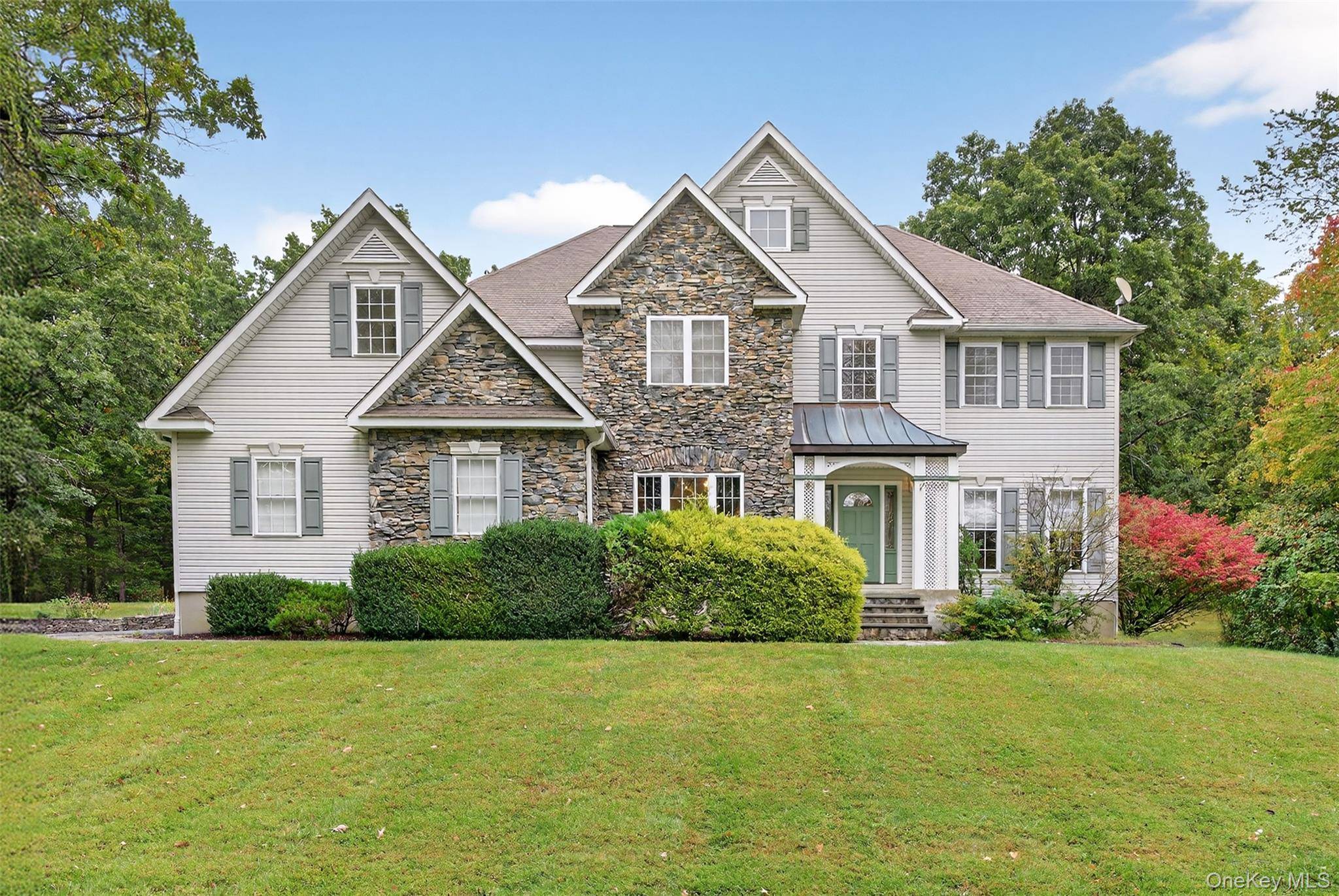Set on two beautifully manicured acres just minutes from the Taconic, this move in ready home offers space, privacy, and polished comfort inside and out.