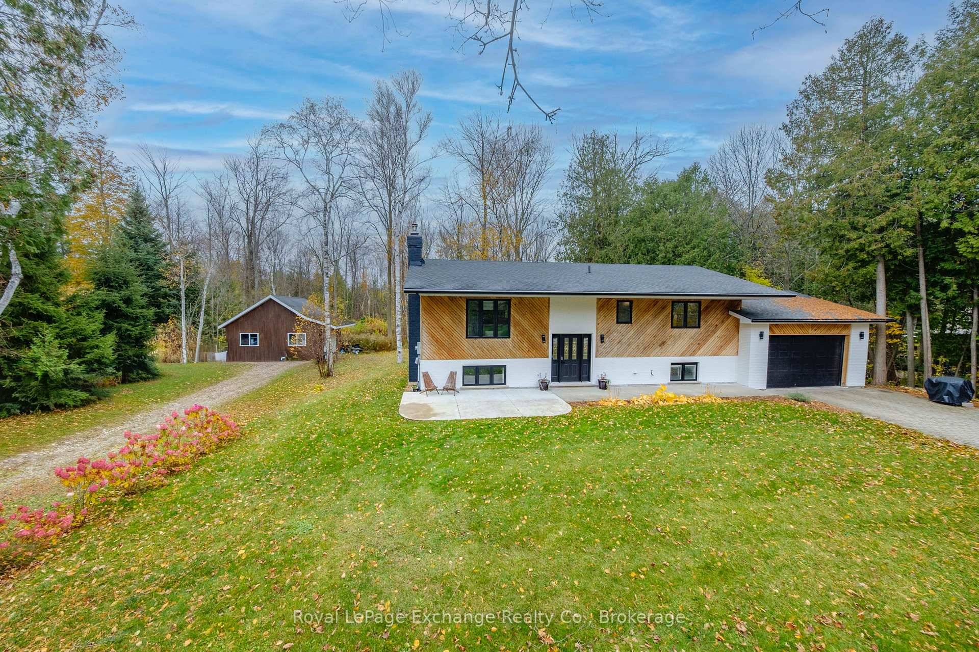 Nestled on a beautifully landscaped half acre lot, this tastefully updated raised bungalow offers a wonderful mix of comfort, functionality, and charm.