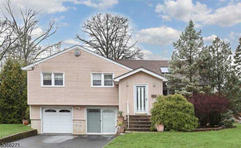 Tucked away on a quiet cul de sac, this freshly painted 4 bedroom, 3 full bath split level home offers immediate occupancy and a versatile layout.