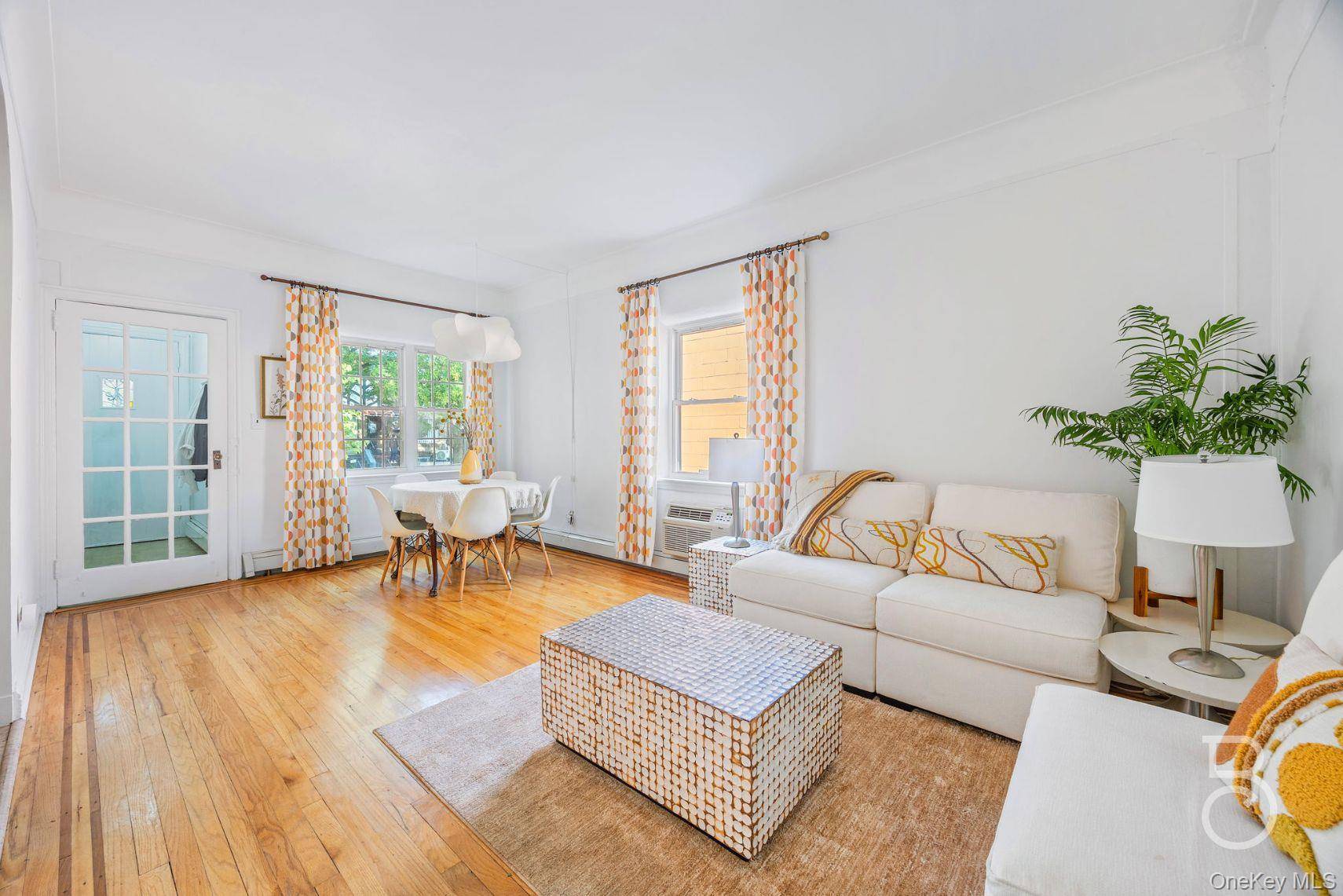 Lovingly maintained and ready for its next chapter, this hard to find semi detached two family brick home enjoys windows on three sides for abundant natural light and cross ventilation.