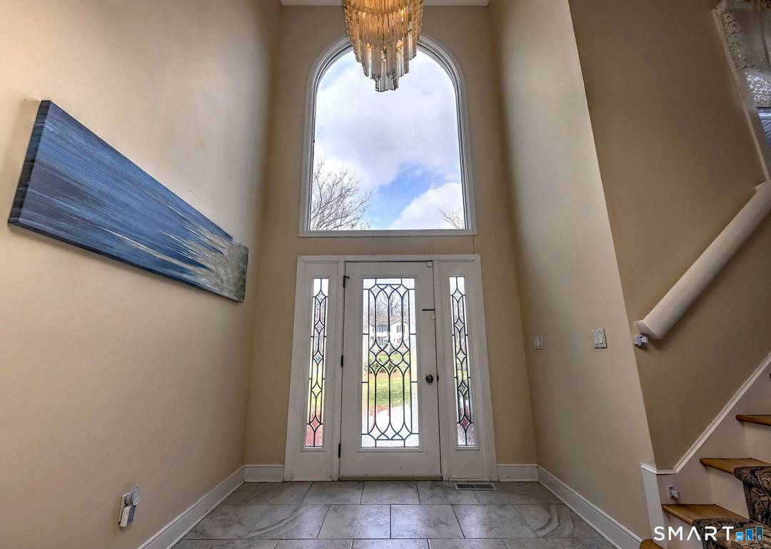 Unique Contemporary home set on a beautiful acre lot in a highly desirable neighborhood.