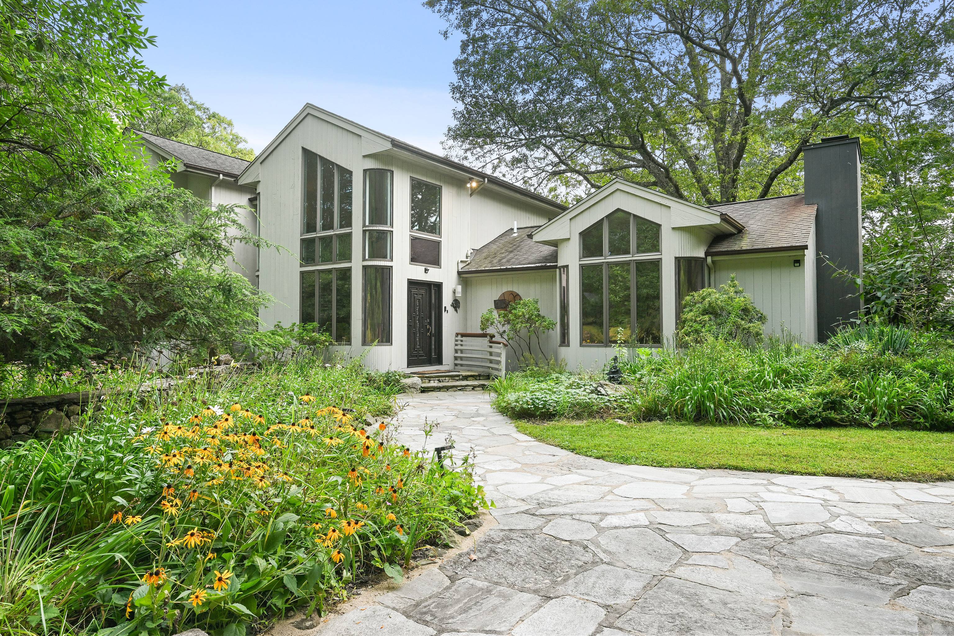 A celebrated artist's estate, this extraordinary mid century modern residence is a statement of design and lifestyle.