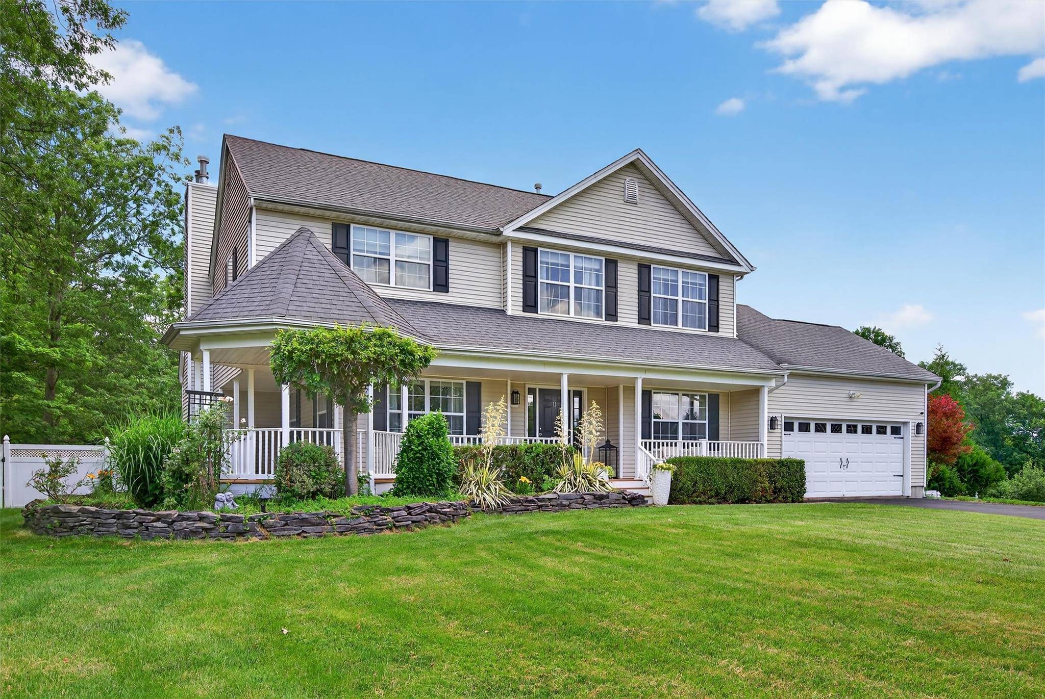 Perched atop a peaceful cul de sac in Goshen s Harness Estates is the Colonial you have been waiting for.