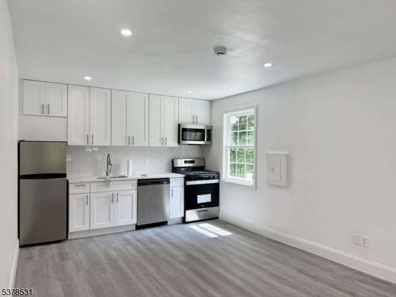Charming and versatile residence offering approximately 2, 285 sq ft of living space, set on a generous 20, 603 sq ft lot.