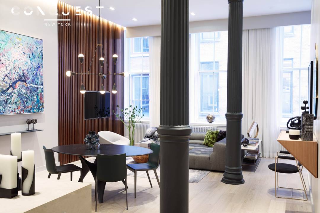 Experience Unit 2E, a sophisticated 1, 446 square foot condominium loft featuring one bedroom plus an office or second bedroom, and two bathrooms, with soaring 14 foot ceilings in the ...