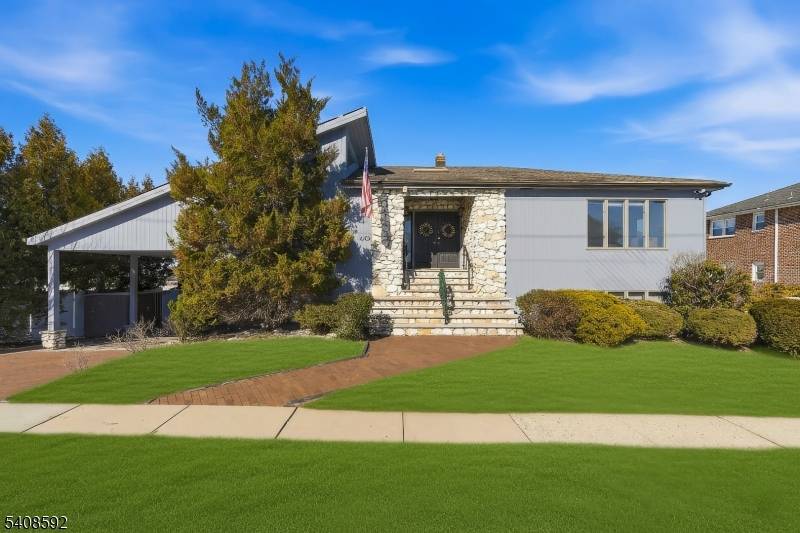 STUNNING TWO FAMILY HOME LOCATED IN A QUIET RESIDENTIAL AREA, CLOSE TO TRANSPORATION, SCHOOLS, PARKS AND SHOPPING AREAS.