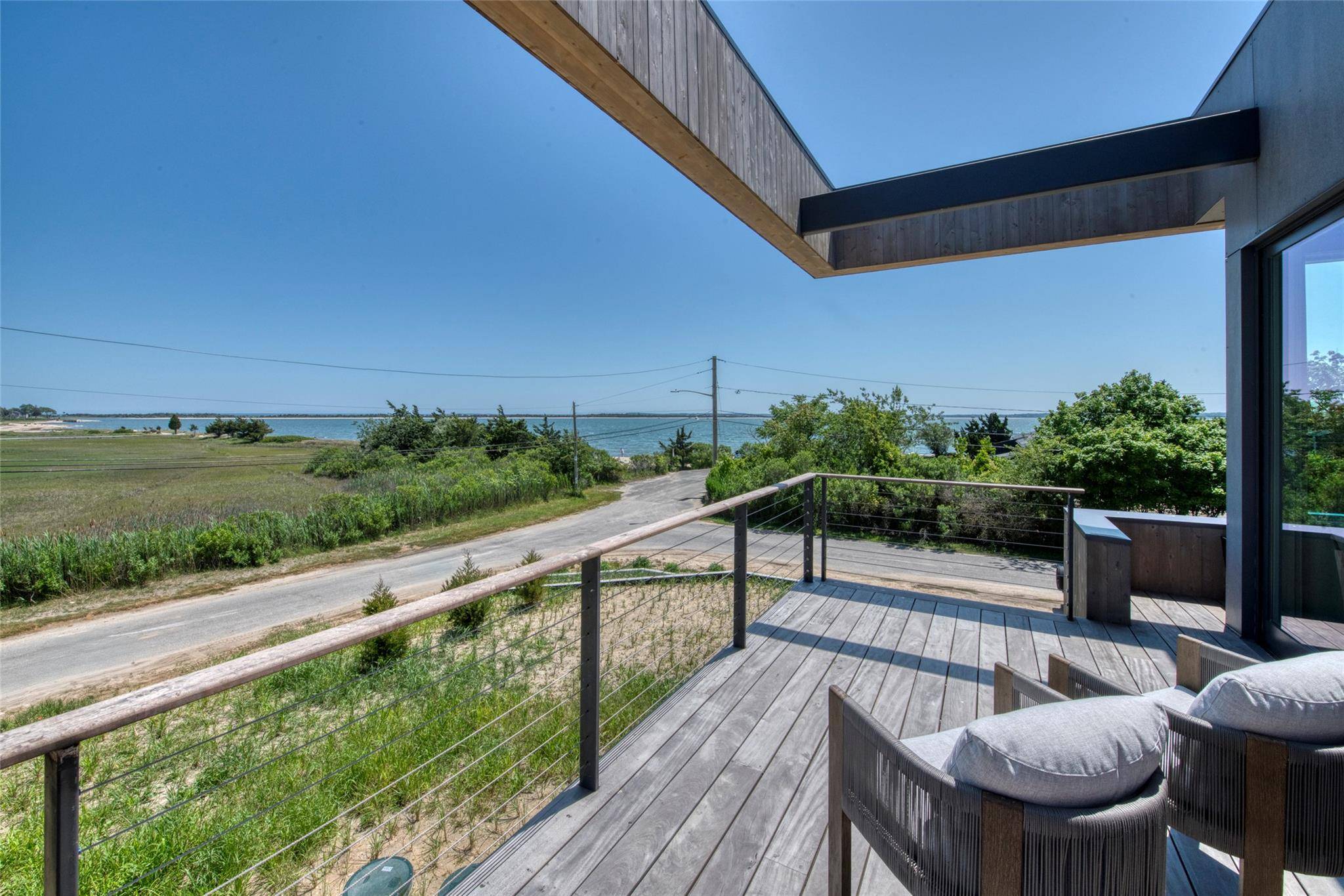 Custom built contemporary home on coveted Narrow River Road in Orient.