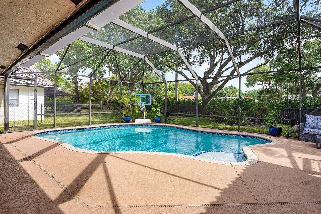 Nestled on a generous 0. 2296 acre lot in the desirable heart of Coral Springs.