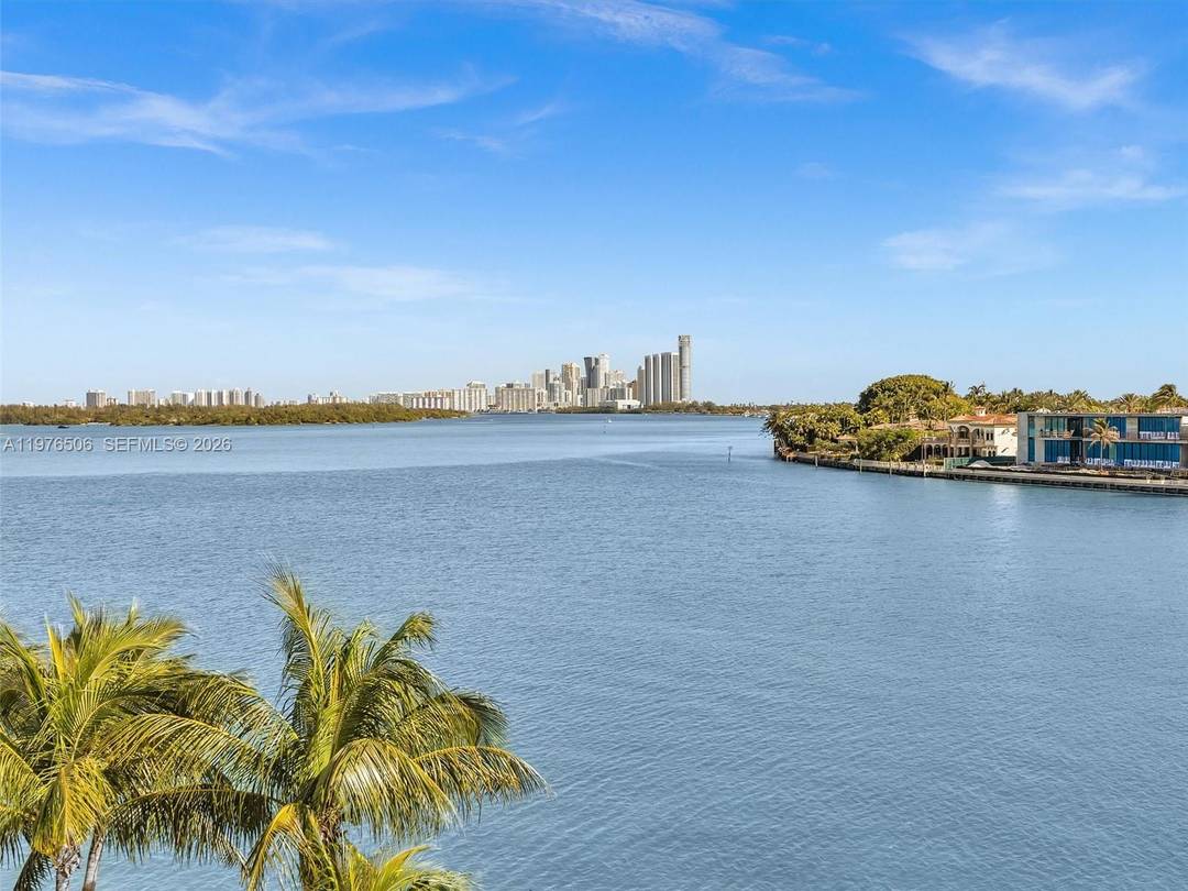 This is a WOW ! Experience some of the best views in Bay Harbor from this stunning corner residence at the luxurious waterfront Sereno Residences.