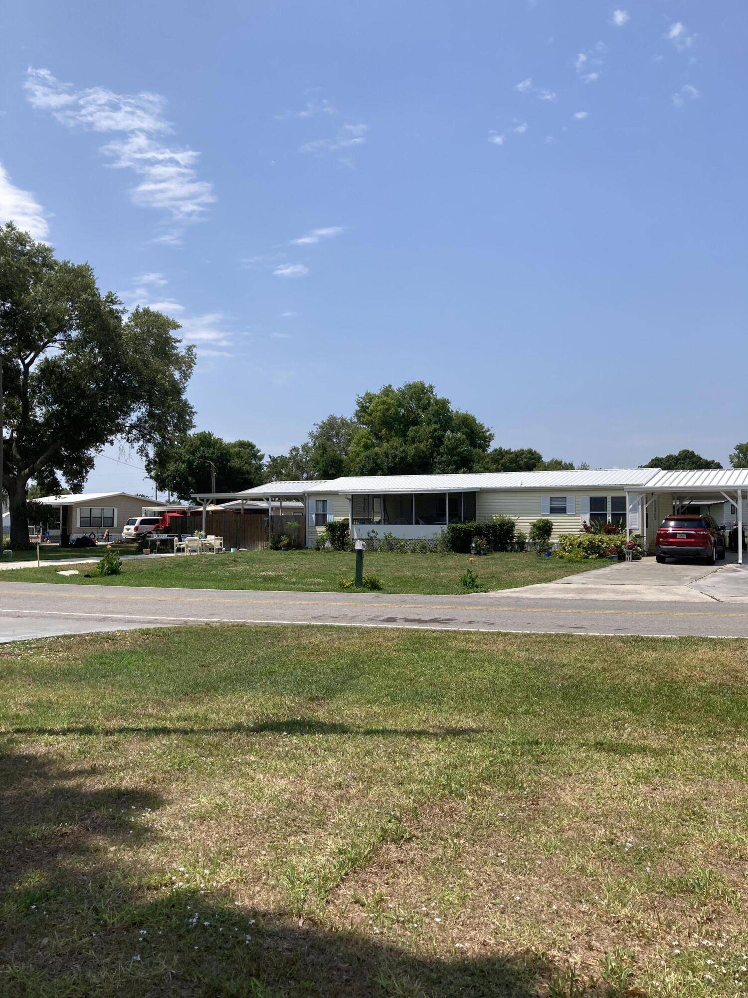 MOTIVATED OWNER ! ! Spacious home with huge covered lanai, 2 'she sheds', above ground pool, screened porch and huge fenced backyard with fire pit.