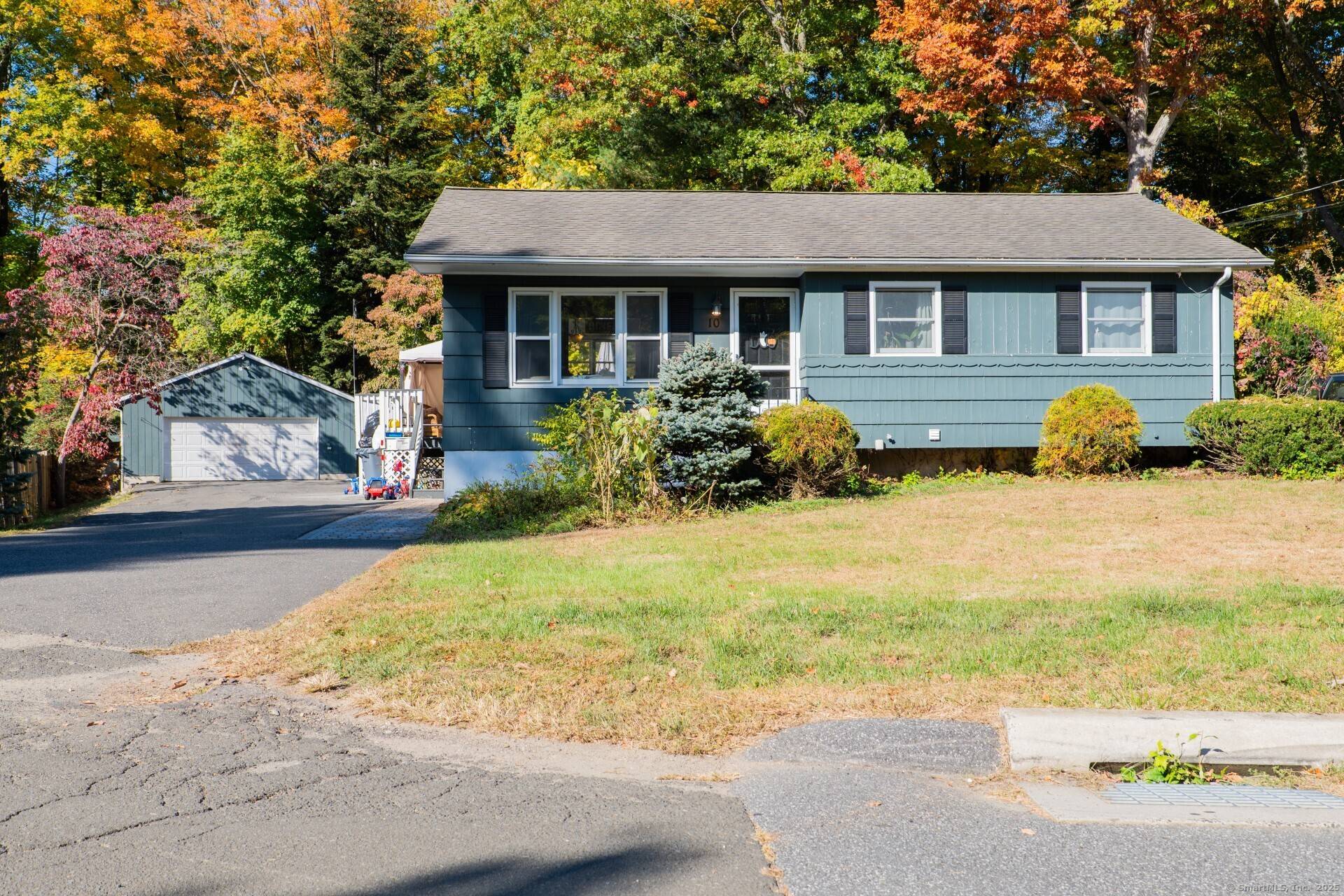 Bethel cul de sac Ranch with 3 bedrooms, 1 1 2 baths, a large deck, and a detached 2 car garage.