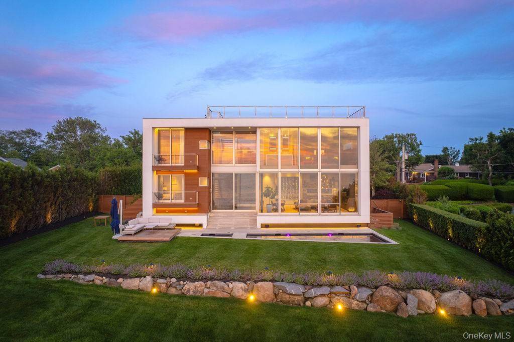 Cutchogue Showstopper ! Designed by world renowned architects Barnes Coy, this modern waterfront masterpiece is a rare blend of cutting edge design and natural beauty.