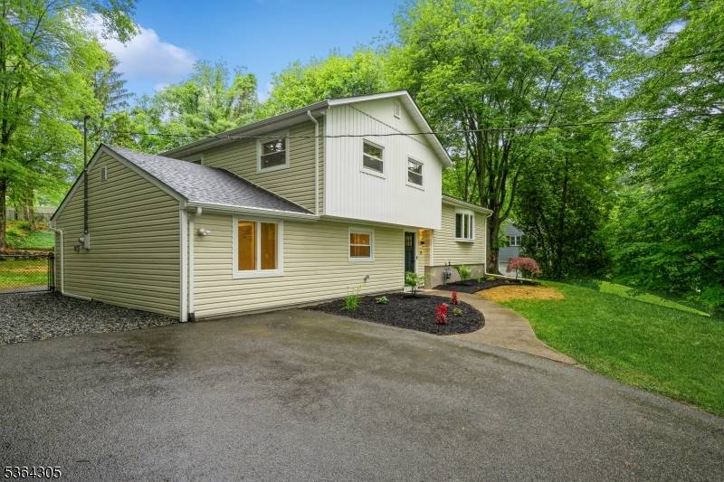 Welcome to this oversized split level home in the heart of West Milford boasting a modern feel with fully renovated interior and exterior.