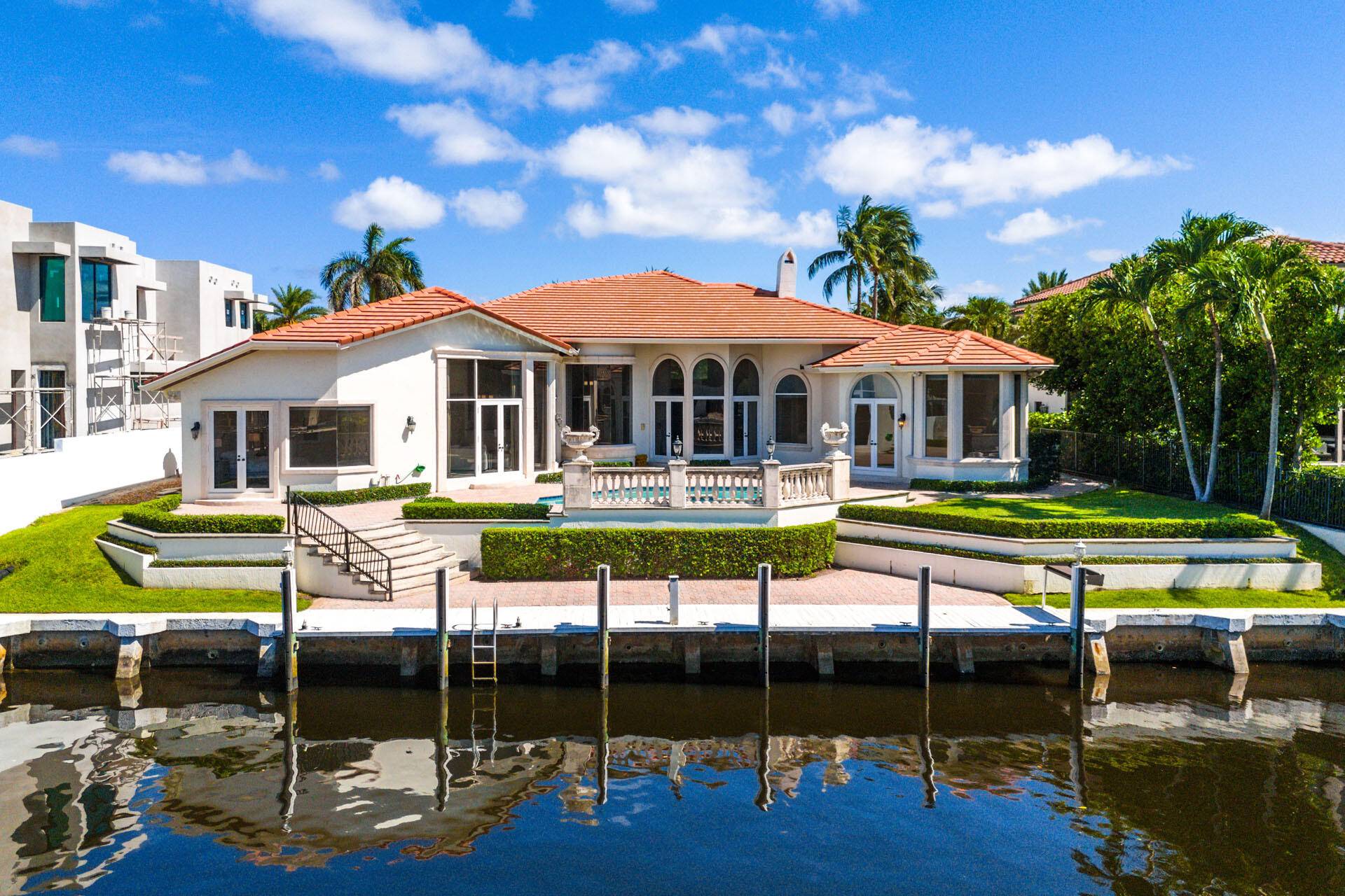 Single story waterfront home available for rent in Royal Palm Yacht Country Club with 4 bedrooms plus office, 4 full and 1 half bathrooms, and 4, 412 sqft under air.