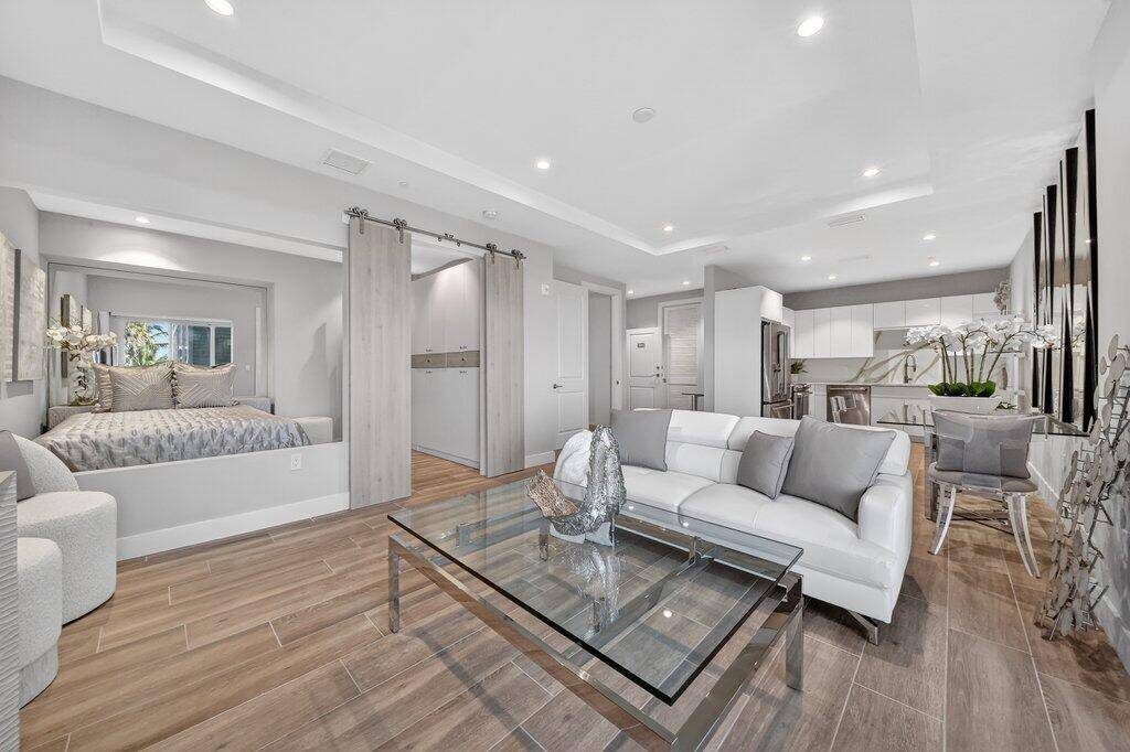 Experience refined waterfront living in this brand new third floor residence with panoramic St.