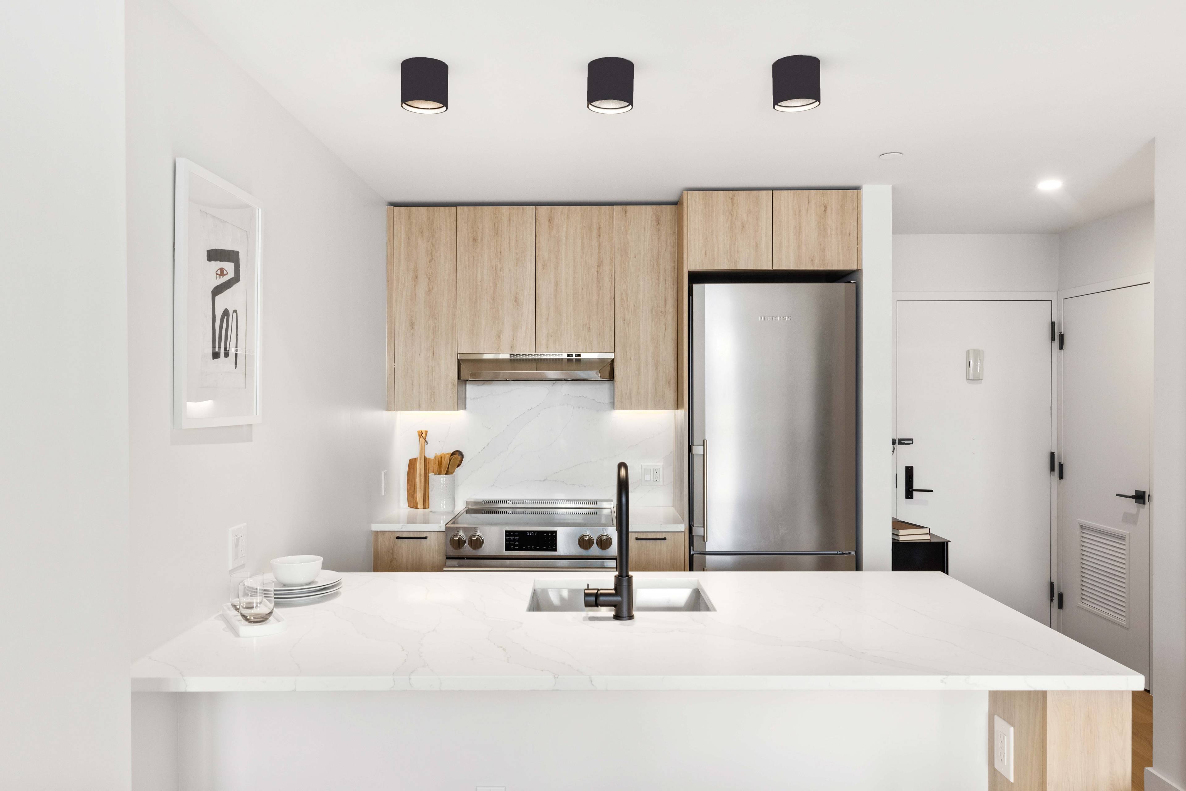 Spacious 1 bedroom unit that CAN BE FLEXED INTO A 2 BEDROOM featuring a private balcony, oversized windows, matte black and Calcutta finishes, custom tiled bathrooms, spacious closets and in ...