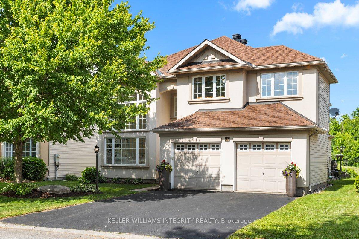 Welcome to this stunning 4 1 bedroom executive home in the prestigious Stonebridge golf course community, perfectly positioned to back onto the fairways with breathtaking golf course and ravine views.