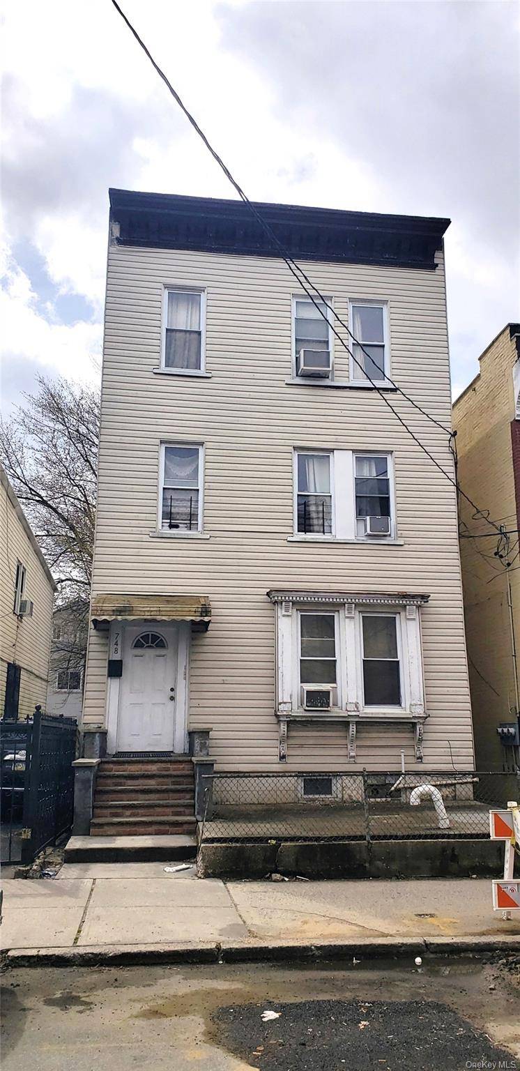 Income Generating Three Family Home in Williamsbridge Ideal for Investors amp ; Owner Occupants.