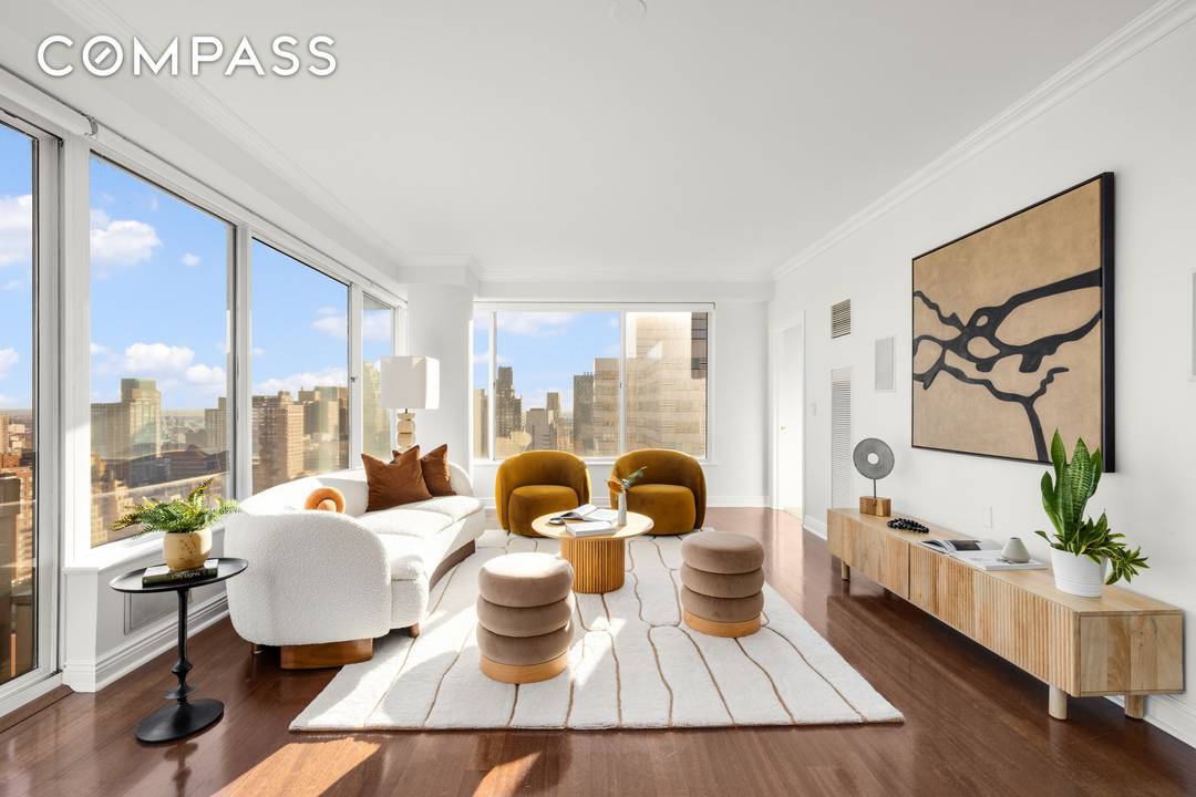 Welcome to 200 East 69th Street 29B, an expansive corner three bedroom, three bathroom residence perched high above the Upper East Side, offering sweeping panoramic views and refined modern living ...