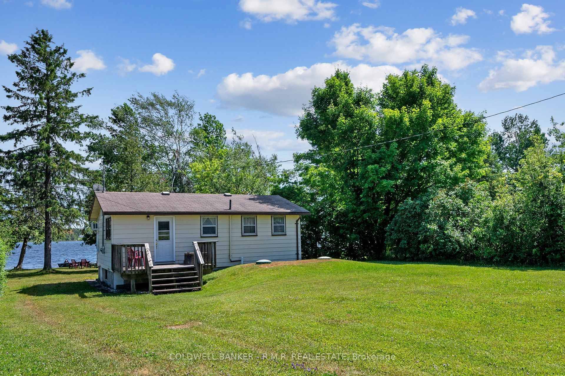 Charming Waterfront Retreat on Canal Lake 253 McGuire Beach Road Escape to the serenity of lakeside living with this delightful 3 bedroom, 1 bathroom cottage nestled on a beautifully level ...