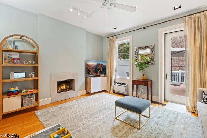 Welcome to 65 Van Reipen Avenue, a tastefully renovated rowhouse that blends modern design with classic Jersey City charm, just a few blocks from Journal Square Path Station.