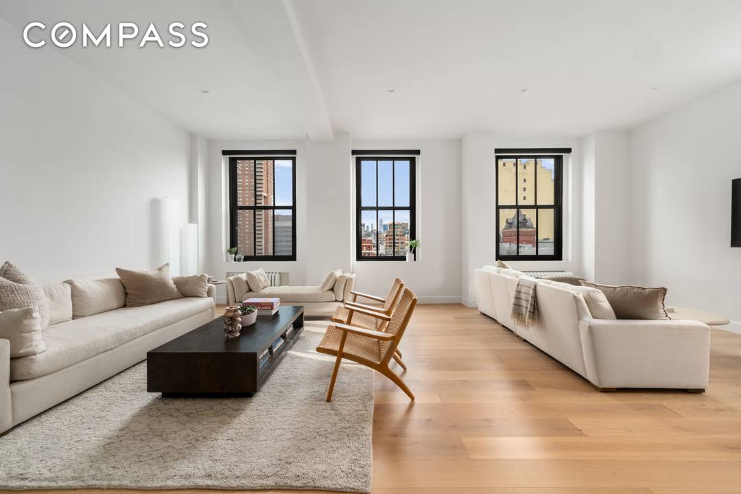 Welcome home to this meticulously reimagined Tribeca duplex loft, where timeless architecture meets modern design.
