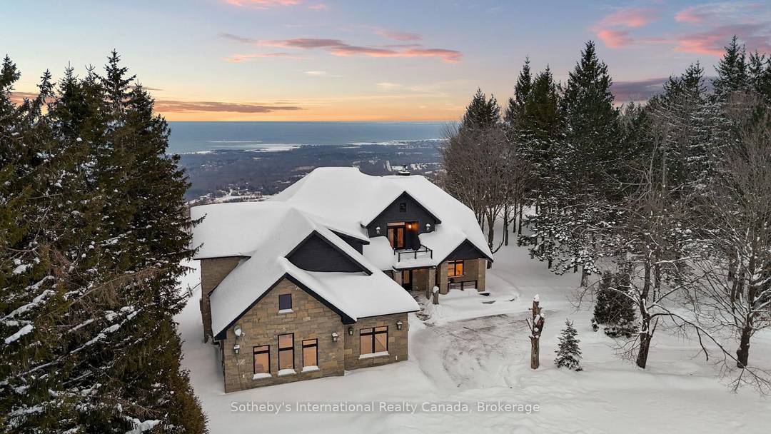 Spectacular estate perched atop Blue Mountain, offering breathtaking panoramic views of the ski hills, Georgian Bay, and the town of Collingwood.
