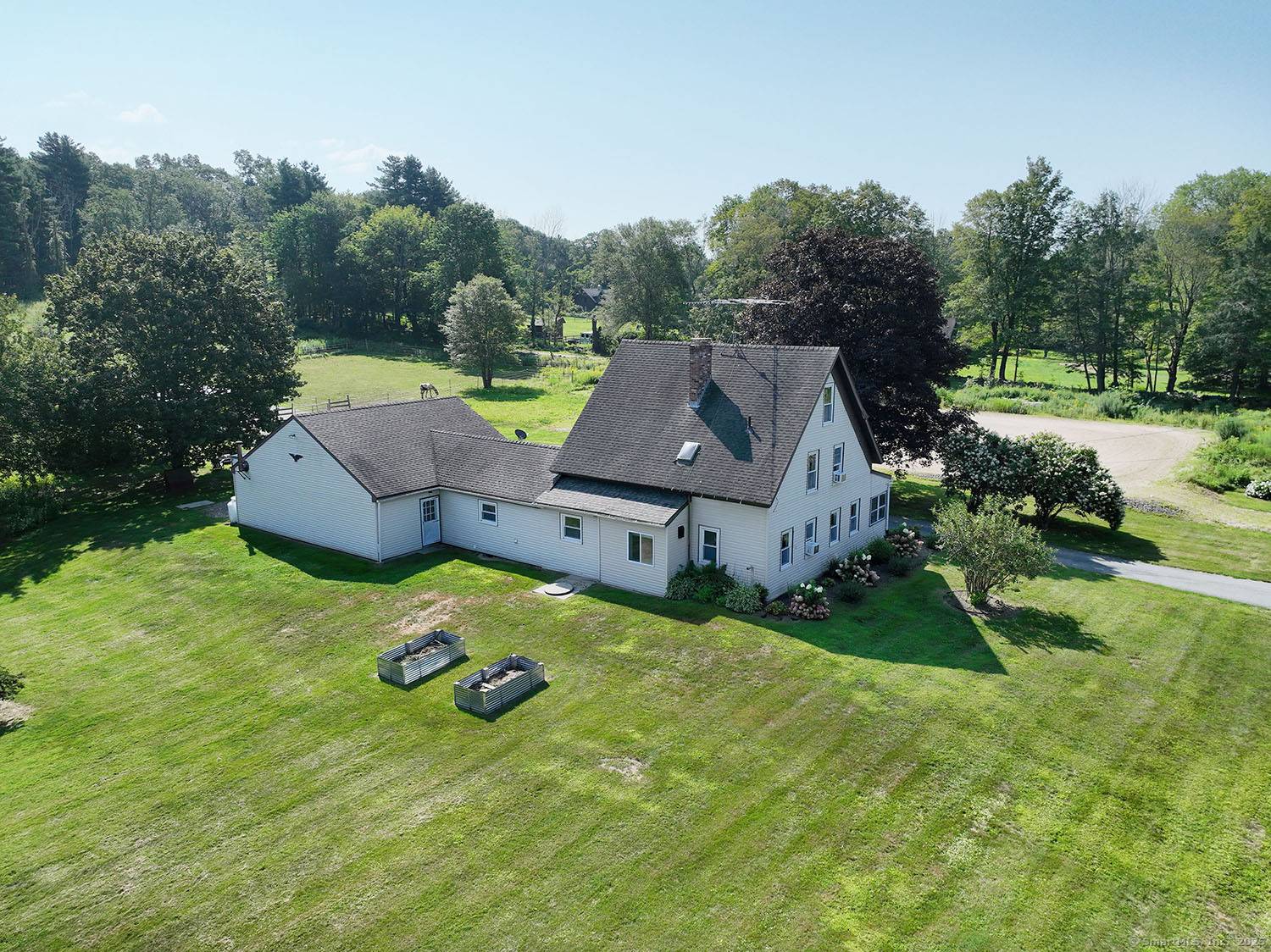 Discover a timeless blend of history and modern comfort at 71 Rawson Road, a lovingly modernized 1800s Colonial style farmhouse located off a serene country road in Woodstock, CT.