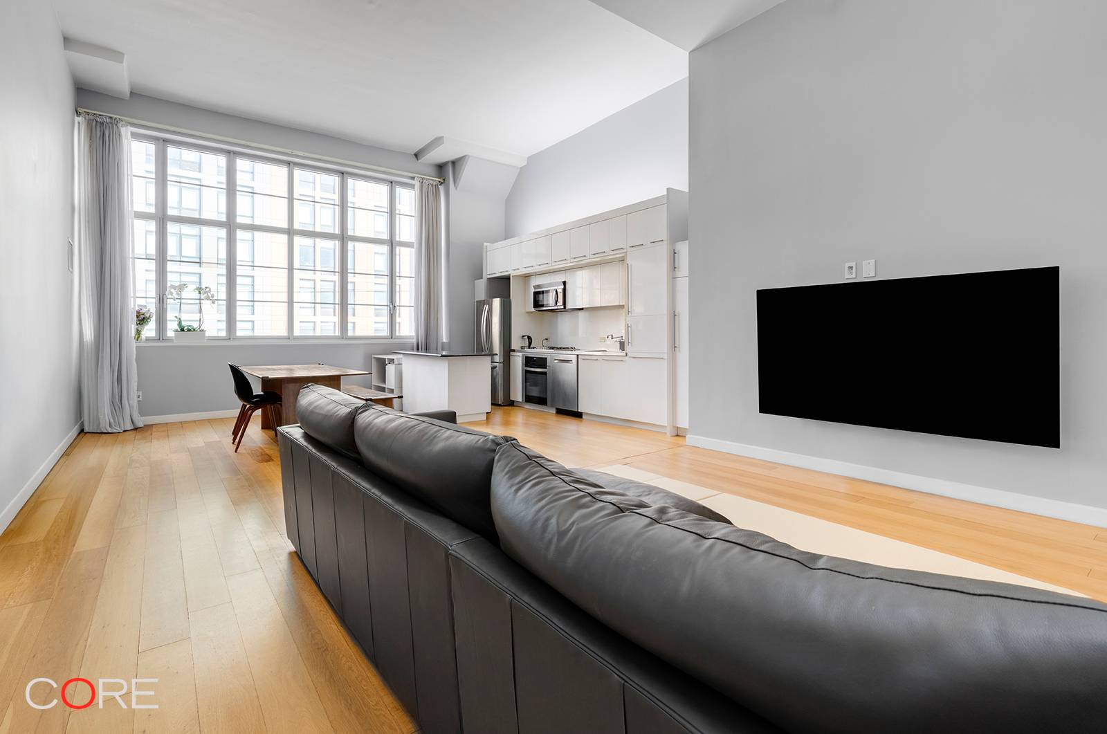 Enjoy your soaring 14' ceilings in this one bedroom home office with two full bathrooms at Arris Lofts, a premier luxury condominium that was once home to Eagle Electric Factory.