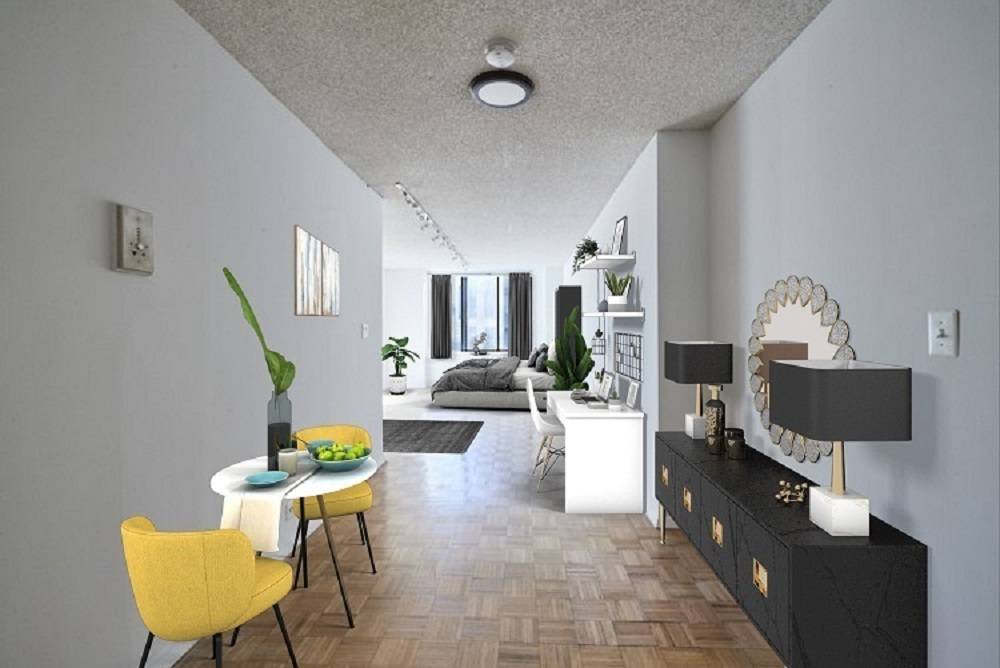 Welcome to this spacious alcove studio in the reputed Fifth Avenue Tower Condominium !