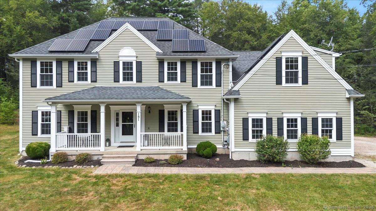 Feel worlds away while being less than 2 miles to town amenities in this like new retreat nestled on an expansive 11.