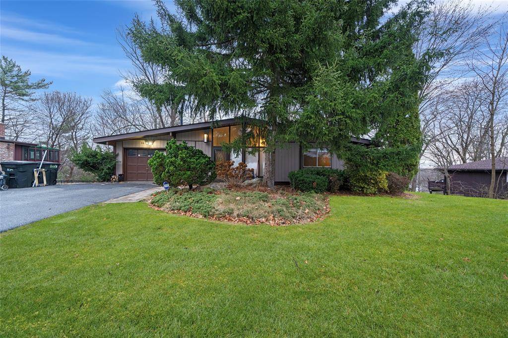 Located in a peaceful and desirable New City neighborhood, this Contemporary home seamlessly combines modern and mid century design.