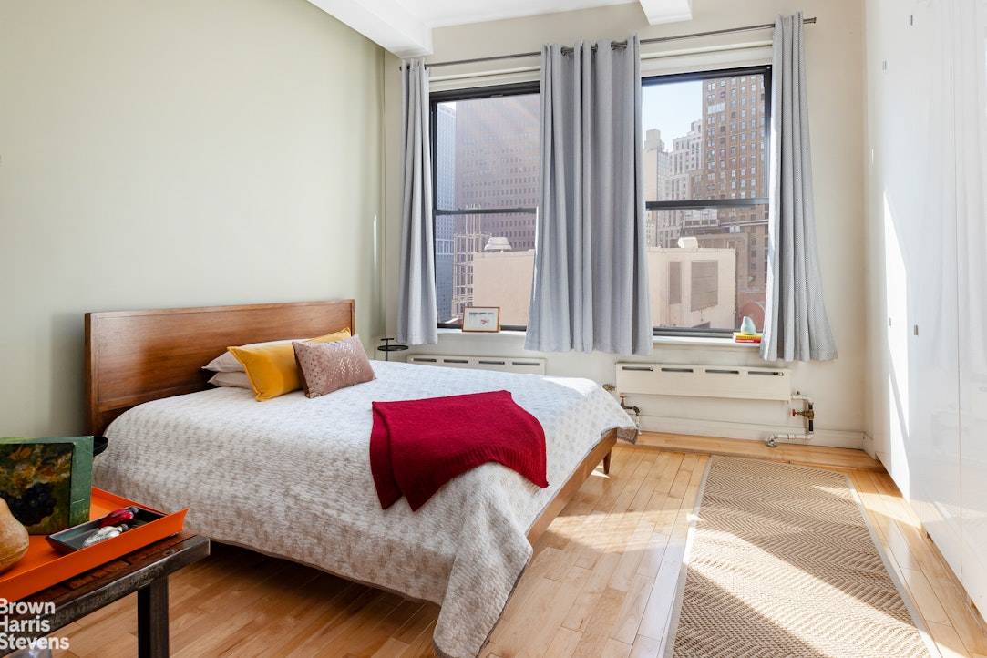 This large loft like studio apartment is located in the historic Cotton Exchange building on Hanover Square in FiDi.