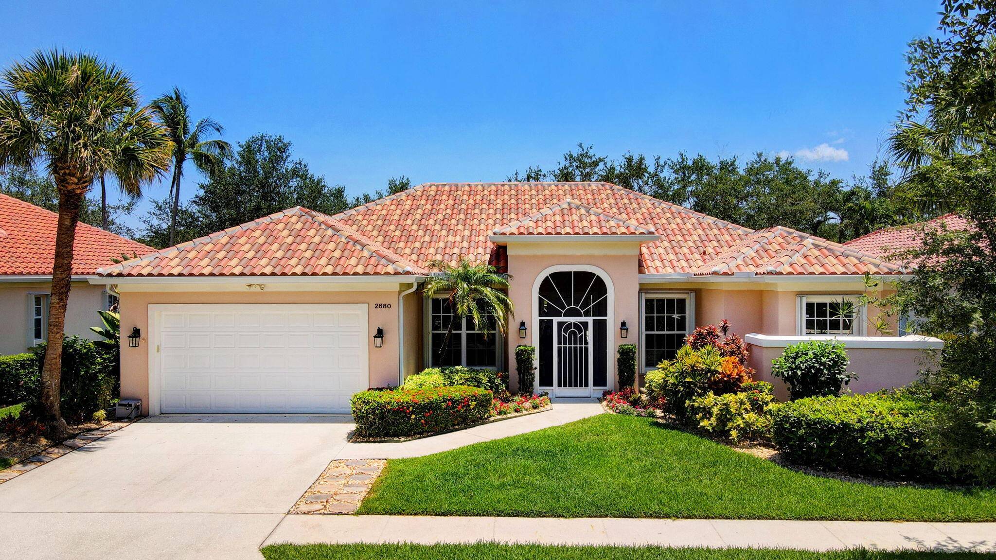 Nestled on a serene cul de sac lot with expansive lake views, this stunning single story home built by DiVosta offers an unparalleled living experience.