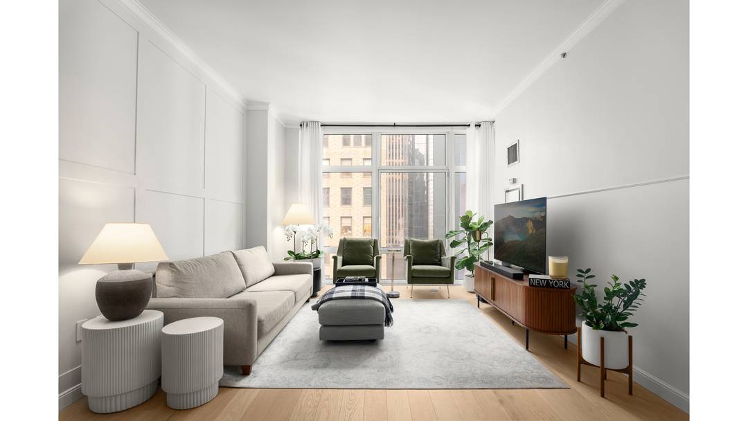 Located in the heart of Times Square, this beautifully renovated one bedroom residence with a home office at 1600 Broadway on the Square seamlessly blends modern luxury with thoughtful design.
