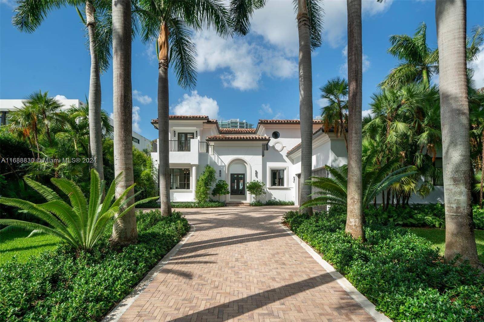 Experience timeless elegance in this beautifully renovated Italian inspired villa, nestled along 85 feet of serene Intracoastal waters in Golden Beach.