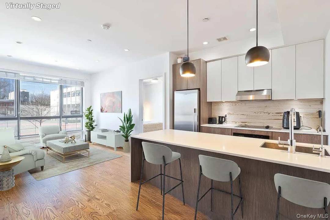 Welcome to this bright and spacious two bedroom, two bathroom luxury condo in the heart of Bushwick.
