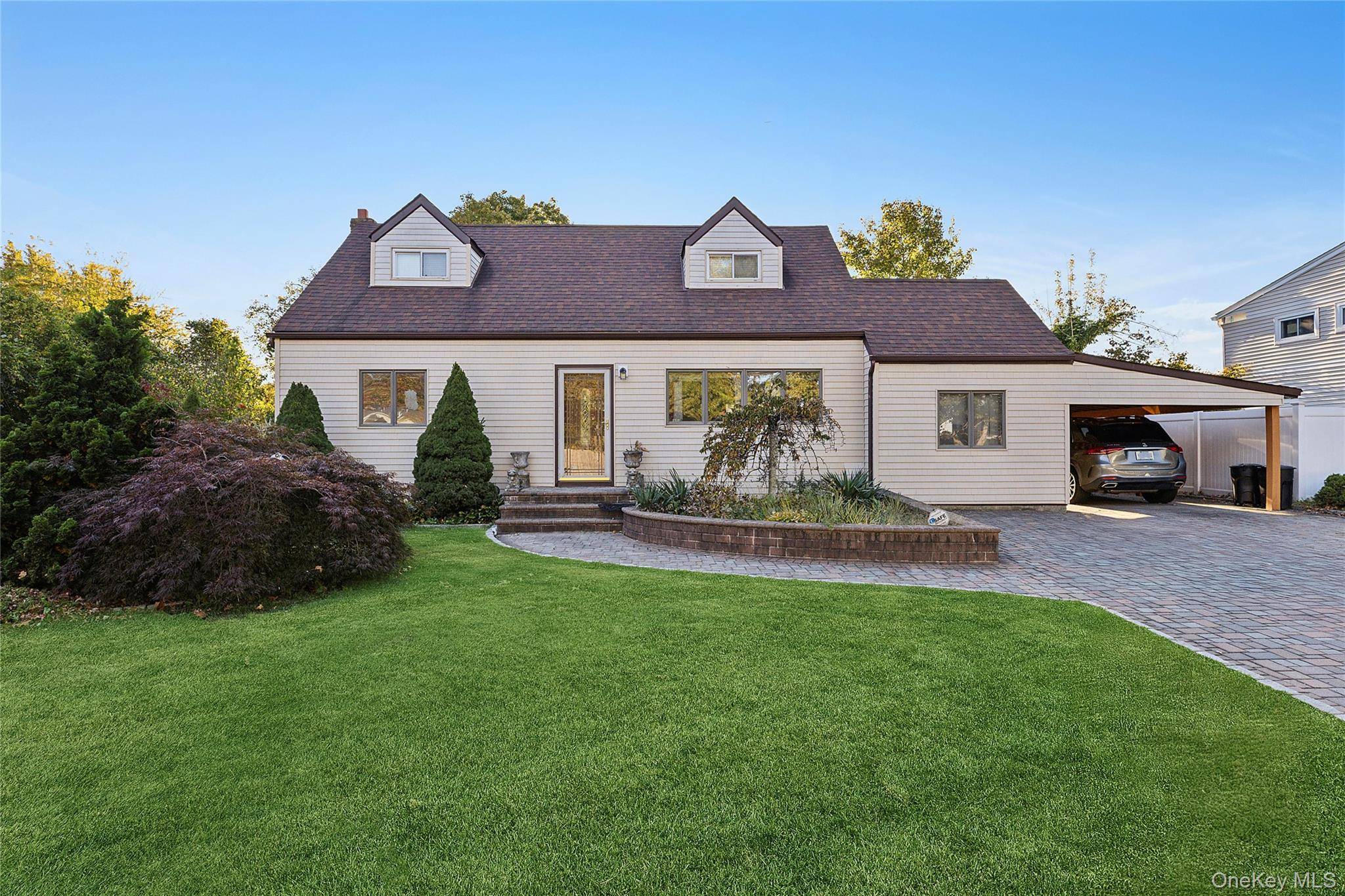 Beautifully maintained 4 bedroom, 3 bath Colonial just 10 minutes from the LIRR station perfect for easy commuting by train, ferry, or bus.