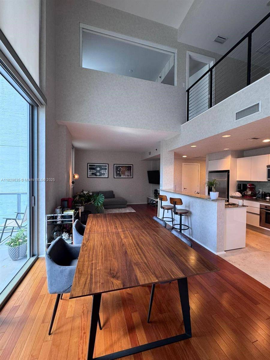Rare corner duplex loft den filled with natural light !