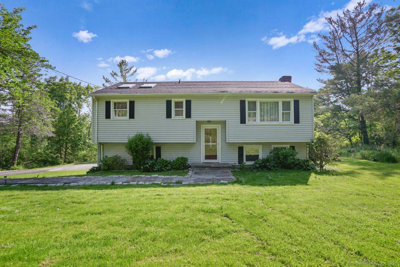 Set back from the road behind a classic stone wall, this 1, 800 sq ft raised ranch, built in 1965, offers a versatile layout and a rare opportunity to buy ...